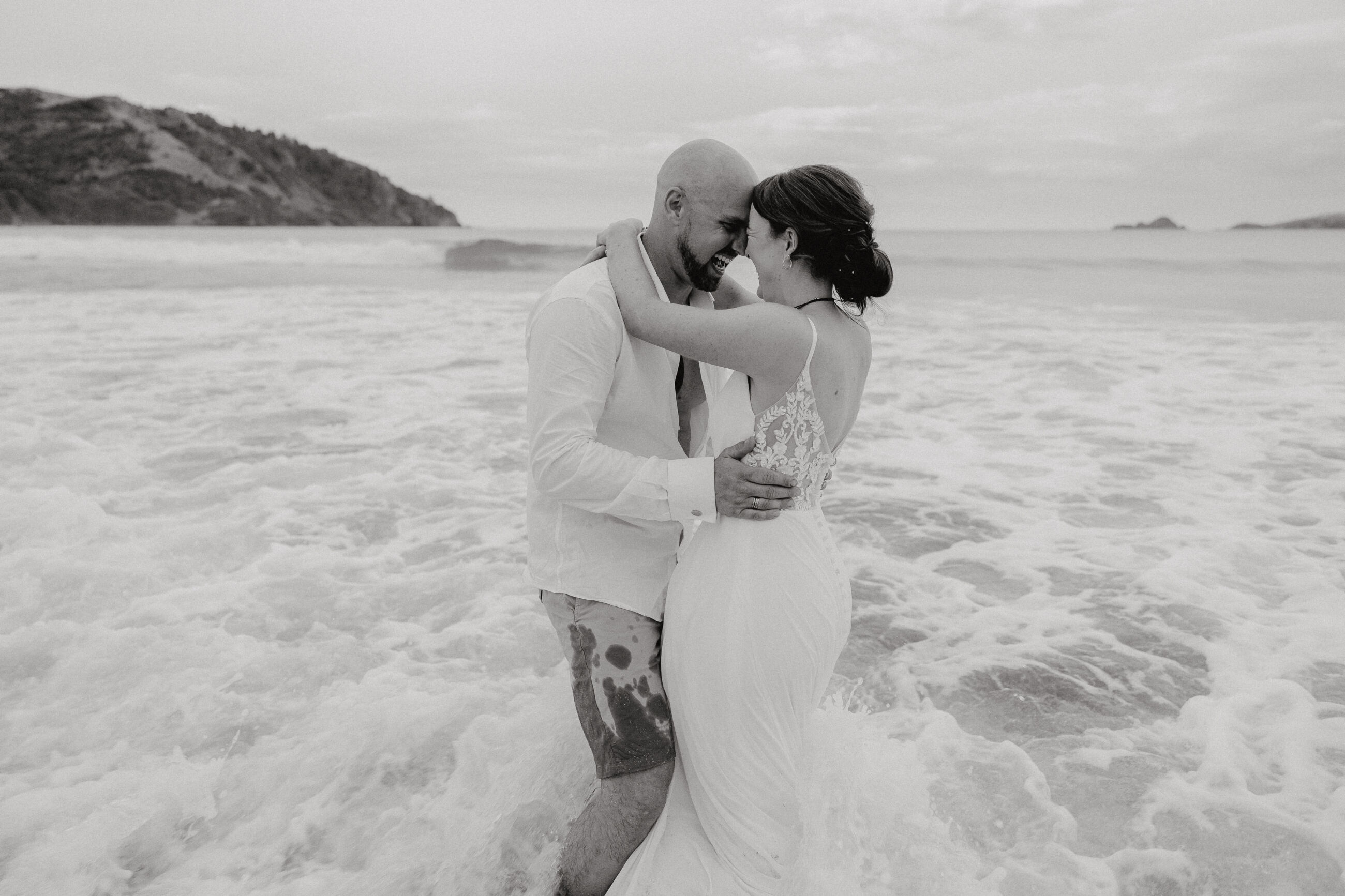 Bride and Groom in the sea, beach wedding